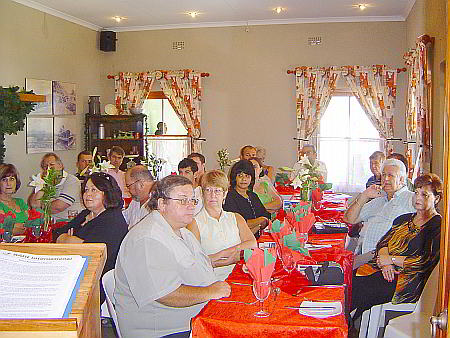 Business Men and Women listen to Jan van Rooyen